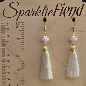 Milky white faceted glass crystal quatrefoil and tassel earrings